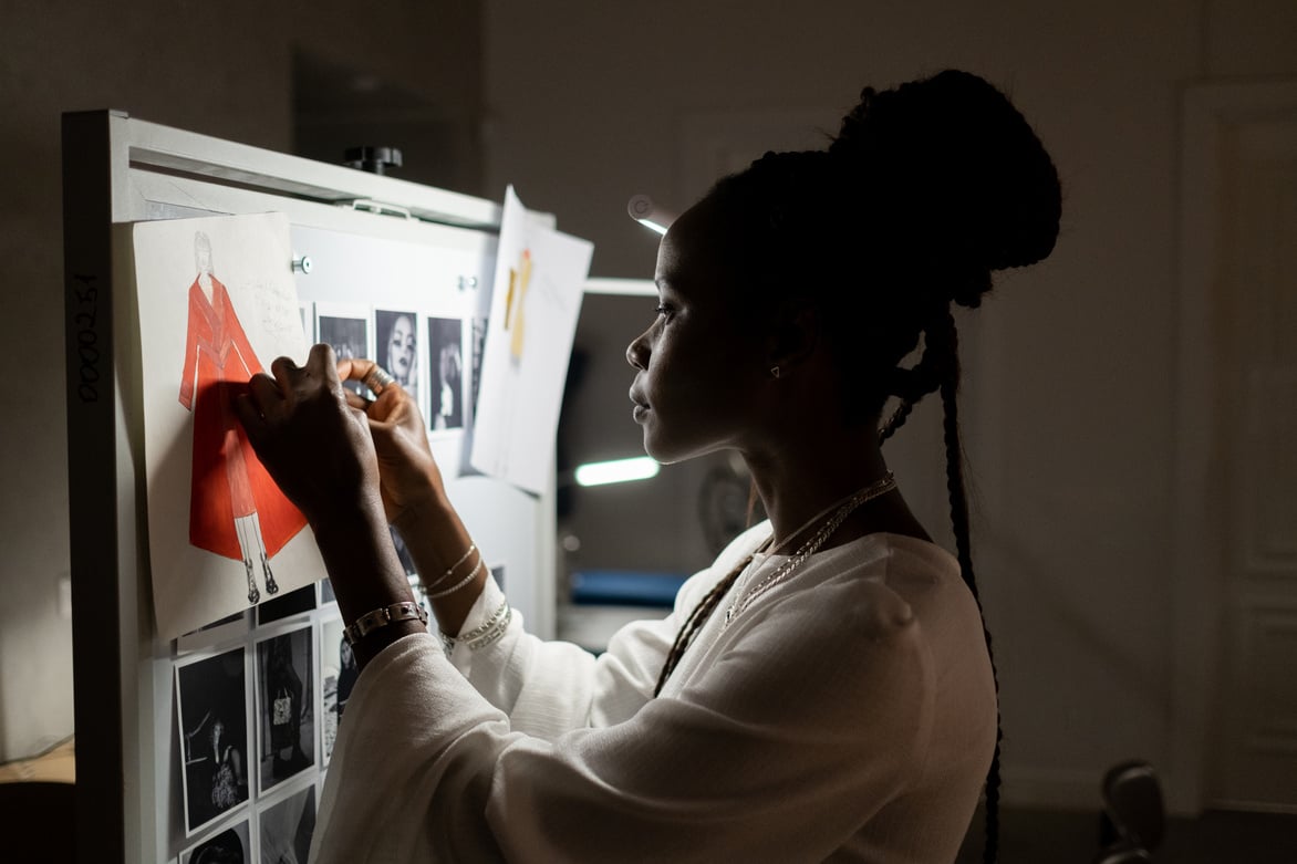 Fashion Designer Working on Whiteboard